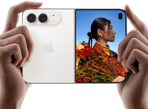 iPhone Duo, Star White color, held by two hands in horizontal orientation, unfolded, left panel shows 48MP Dual Fusion rear cameras, right panel shows person getting their picture taken on outer display, the subject of the photo is able to see their face as their picture is getting taken using Duo Preview