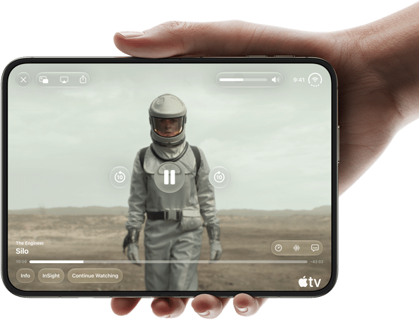 iPhone Duo, held with one hand, opened in horizontal orientation, fully unfolded, interior screen displays Apple TV show
