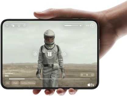 iPhone Duo, held with one hand, opened in horizontal orientation, fully unfolded, interior screen displays Apple TV show