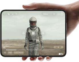 iPhone Duo, held with one hand, opened in horizontal orientation, fully unfolded, interior screen displays Apple TV show