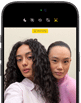 iPhone 18 Pro, black, front exterior, displaying two models posing for the camera, demonstrating the Center Stage front camera